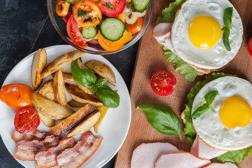 Breakfast with eggs, potatoes and salad