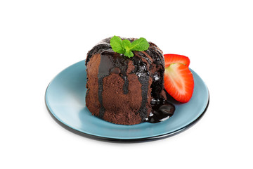 Delicious warm chocolate lava cake with mint and strawberries isolated on white
