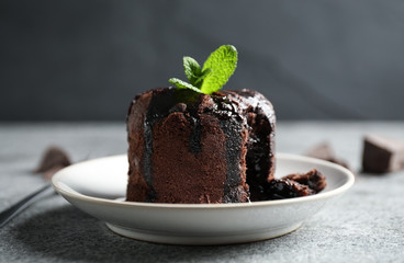 Delicious warm chocolate lava cake on grey table