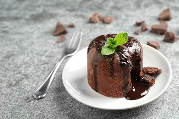 Delicious warm chocolate lava cake on grey table