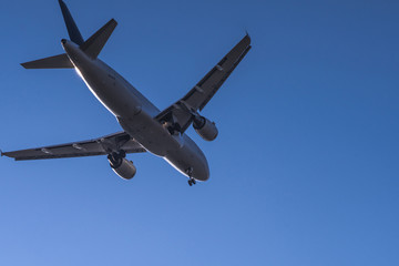 Close bottom view to landing passenger jet with clear sky at munich