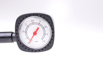 Pressure gauge for measuring air pressure in automobile tires isolated on white background