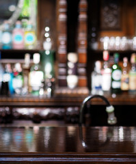 Wooden table blur bar alcohol background.