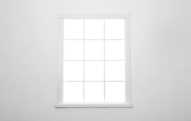 Simple vintage window on white wall indoors