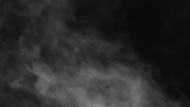 Slow motion water mist over black background