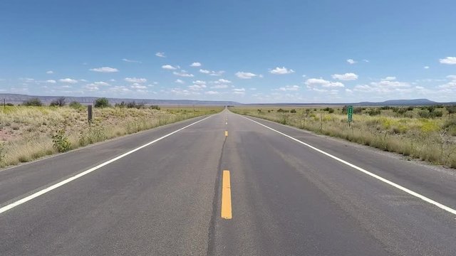 Route 66 lonesome deserted roads and landscapes with blue sky and white clouds in Texas, New Mexico and Arizona. Includes five different video sequences!