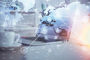 Computer on desktop with social network theme icon. Multi exposure. Concept of international connections.