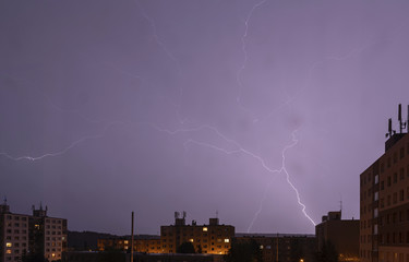 lightning over buildings at night