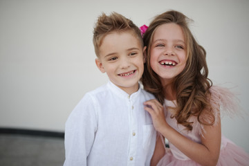 young happy boy and girl together outside
