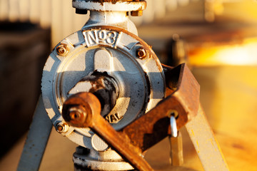 rusty handle for irrigation pump for a greenhouse