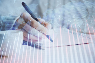 Forex chart displayed on woman's hand taking notes background. Concept of research. Double exposure