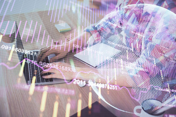 Multi exposure of forex graph with man working on computer on background. Concept of market analysis.