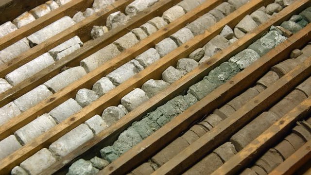 Drill core samples from geological borehole in wooden box