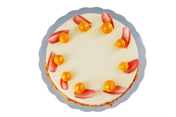 Chocolate cake with physalis fruits, cream, nuts and mousse