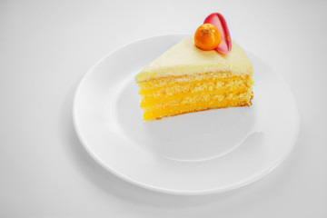 Chocolate cake with physalis fruits, cream, nuts and mousse