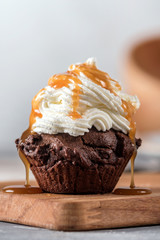Chocolate cupcake with cream and caramel