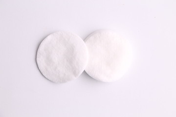 Cleansing cotton discs in colorful background
