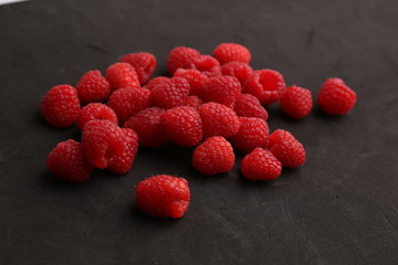 delicious raspberries in colorful background
