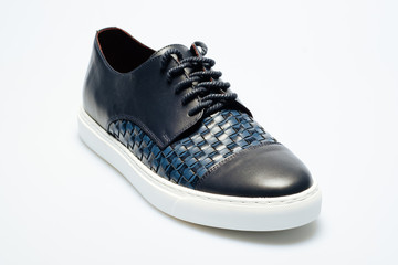 blue leather shoes on a white background