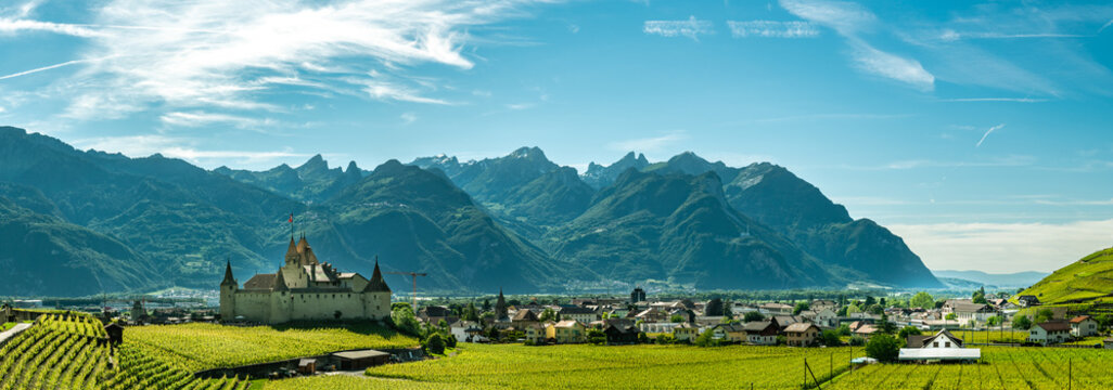 Panoramic view on city of Aigle with beautiful castle and Alps in background