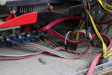 A lot of dust in the system unit of the computer. Copy space - the concept of cleaning and repairing old equipment, short circuit wiring.