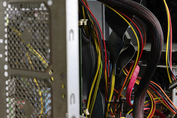 A lot of dust in the system unit of the computer. Copy space - the concept of cleaning and repairing old equipment, short circuit wiring.