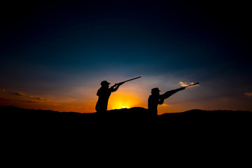 Fototapeta na wymiar Hunters and rifle silhouette women