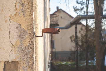 wall with pipe stand. rusty wall fasteners