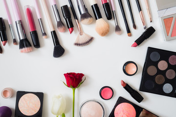Obraz na płótnie Canvas Make up concept: Professional makeup tools and accessories. Lipstick, mascara, nail polish, eyeshadow, powder, eyelash and foundation. Top view.