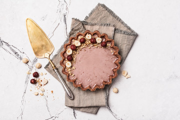 Obraz na płótnie Canvas Delicious walnut tart with hazelnut