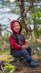A small child expresses emotions. Emotional little boy close up