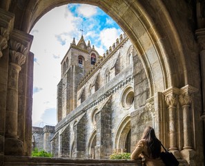 Female admiring the cathedral of Alcobaca in Portugal