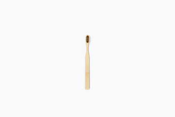 Zero waste picture. Wooden toothbrush on isolated white background. Flat lay, top view.