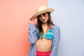 Young woman in bikini laughing