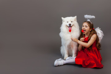 Faithful friends, a girl and a dog. Friendship symbol