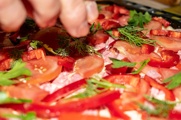 Pizza close-up in the process of cooking and ready-made.