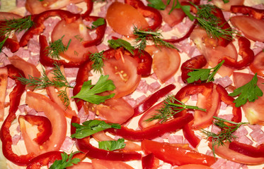 Pizza close-up in the process of cooking and ready-made.