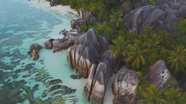 Aerial drone view on the beautiful white sand rocky beach in the seychelles, La digue silver bay