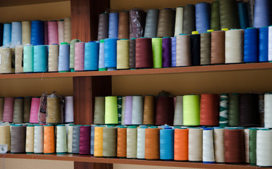 Multi-colored bobbins of sewing thread