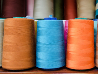 Multi-colored bobbins of sewing thread