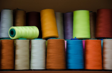 Multi-colored bobbins of sewing thread