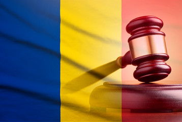 Legal gavel over a flag of the Romania