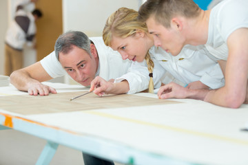 apprentice studying wallpaper design