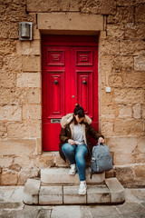 .Pretty young girl traveling around the island of Malta. Knowing its culture and visiting the old capital, Mdina, known as the Silent City. Relaxed and carefree. Travel photography. Lifestyle..