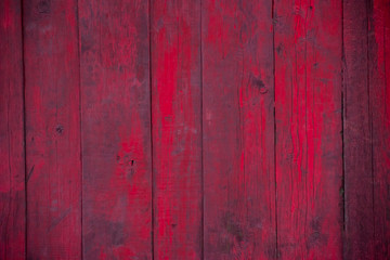 red, vinous, maroon vertical wood fence. wallpaper. background