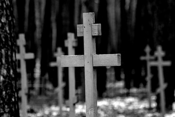 black and white photo of the cross in the old cemetery