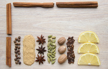 Flat Lay herbs and spices for mulled wine. Clove, cinnamon, star anise, allspice, nutmeg, cardamom, ginger, east, indian pepper.