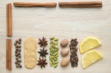 Flat Lay herbs and spices for mulled wine. Clove, cinnamon, star anise, allspice, nutmeg, cardamom, ginger, east, indian pepper.