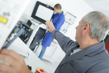 Fototapeta na wymiar middle age man fixing a printer