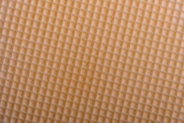 Part of wafer cake layer with cream from condensed milk and butter. Wafer background